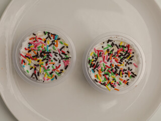 Sweet dessert in a cup with sprinkle on top
