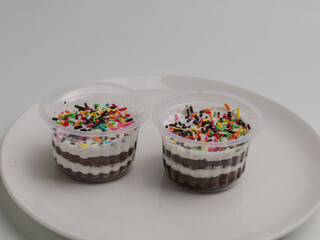 Sweet dessert in a cup with sprinkle on top