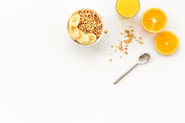 Bright breakfast with granola and orange juice on white background top view mockup