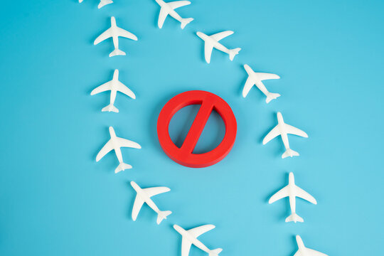 Planes fly around the restricted air zone. Airplanes fly near a restricted air zone, avoiding prohibited areas. Concept of airspace regulation, flight route adjustments, and aviation restrictions.