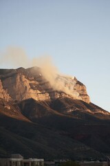 Fototapeta premium Mountainside smoke plume
