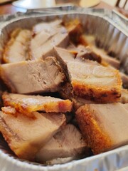 grilled pork chops in takeout aluminium foil