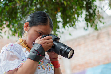 Indigenous photographer taking pictures with professional camera.Photography day