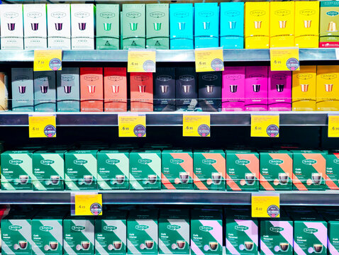 LATVIA, RIGA, JUNE, 18, 2025: Cafe Baque coffee capsules of various roast levels and flavors on shelves in a supermarket, Riga, Latvia