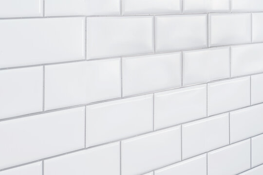 white subway tile wall background on vanishing angle