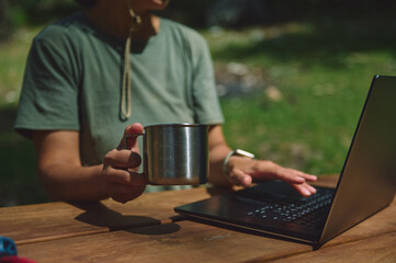Outdoor Work Setup with Woman and Laptop for Digital Nomad Lifestyle in Nature