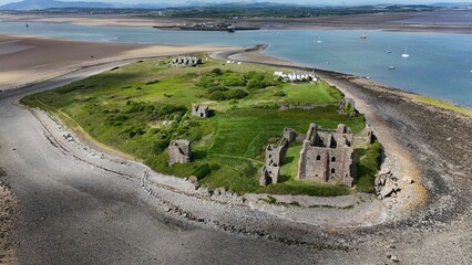 Elevated drone photo of Piel Island with castle and settlement ruins, showing surrounding tidal flats and scenic coastline. © PJSCreativeWorks