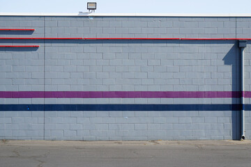 Outdoor building wall with painted stripes