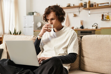 Cozy afternoon with a young man enjoying coffee while working from home