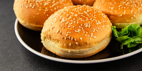 Bun burger puffy soft buns baking fresh delicious gourmet food background on the table rustic food top view copy space