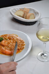 Dining on a Delicious Seafood Dish with Rich Sauce and Bread