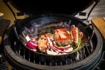 bbq grilling game meat from a chamois in a pan on a charcoal grill