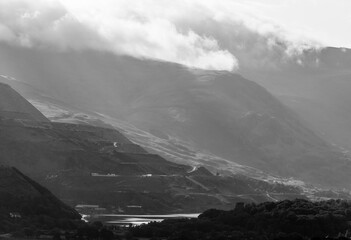 Black and white view of Llyn Peris in Snowdonia, with Dinorwig Slate Quarry and hydro electric...