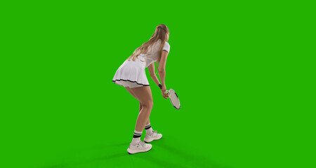Woman tennis player playing tennis on green screen background.