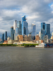 Tall office and apartment buidlings of Hudson Yards along the waterfront in Manhattan seen from a cruise ship on Hudson