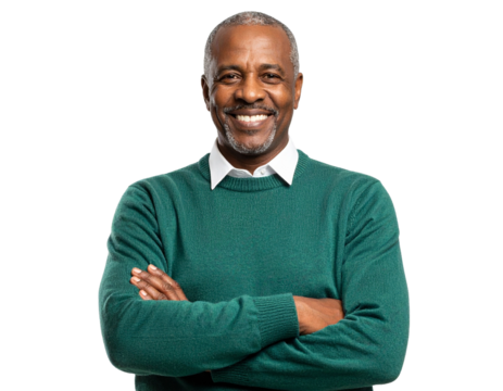 An assured elderly man, clad in a green sweater with arms folded, on a transparent background.