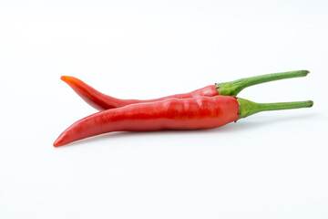 Two Vibrant Red Chili Peppers Resting on a Clean White Background