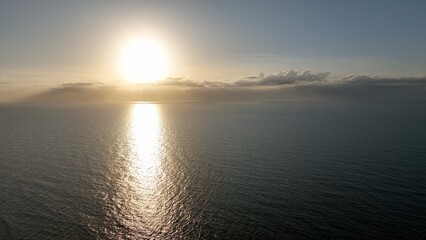 Morning sunlight on peaceful, relaxing ocean and beach at Litchfield Beach, South Carolina low country lifestyle aerial view summer morning by the Atlantic coast