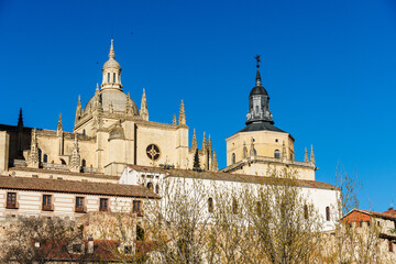 The Segovia Cathedral stands proudly in the skyline, with the Guadarrama mountains visible.