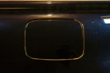 Expertly polishing the black car's surface reveals a deep shine while eliminating any blemishes and...