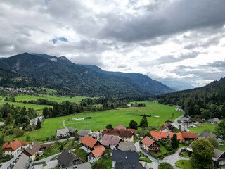 aerial view of village in the julian alps (slovenia) with mountains in the background beautiful...
