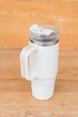 White HANDLE TUMBLER on wood table