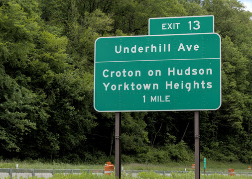highway road sign for underhill avenue croton on hudson yorktown heights one mile (1 mile marker exit 13 under hill ave) driving travel highway signage