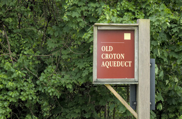 Old Croton Aqueduct trail sign in Ossining New York.