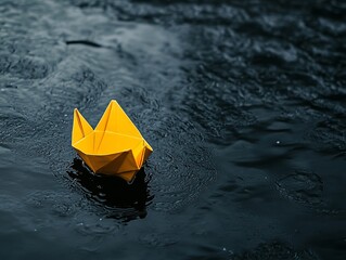 Minimalist Depiction of Hope: A Small Yellow Paper Boat on Dark Water