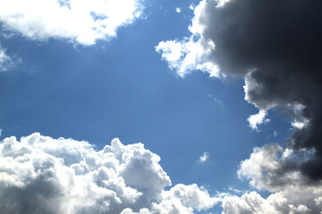 Blue sky with large snow - white clouds