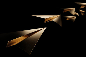Gold foil paper planes floating on black background with dramatic lighting