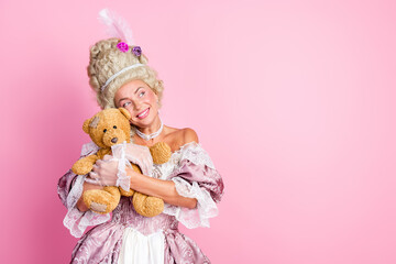 Elegant woman in vintage royal attire holding a teddy bear against a pink backdrop, evoking historical charm and humor