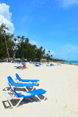El Cortecito, Punta Cana, Dominican Republic- June 12, 2025: People walking along the coastline and sunbathing on one of the best beach in Caribbean area. Lots  of seaweed, specifically Sargassum.
