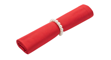Red napkin tied with pearl ring isolated on white background  