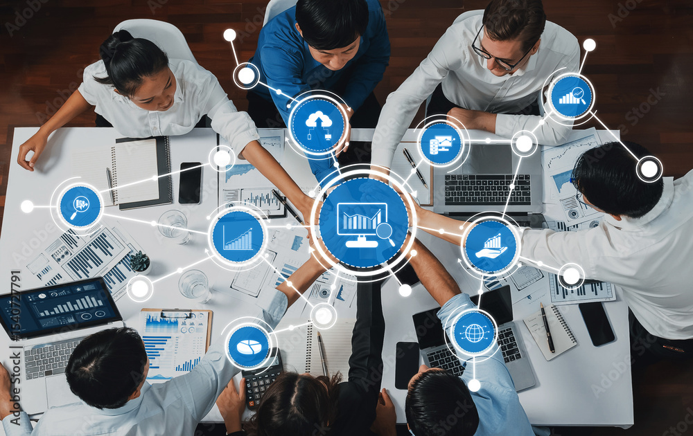 Poster A diverse group of professionals collaborates in a modern office setting, analyzing data on laptops and discussing strategies through digital visualizations and reports. Amity