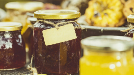 Glass jars filled with homemade jams, pickles, and preserved vegetables.
