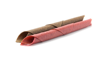 Delicious fruit leather rolls on white background