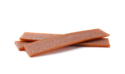 Pieces of delicious fruit leather on white background