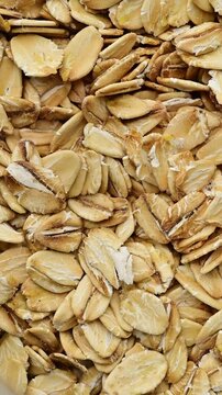 Oat Flakes in Motion: Close-Up Texture
Hercules Oats Close-Up: Natural Grains on White Background