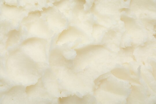 Texture of organic shea butter as background, top view