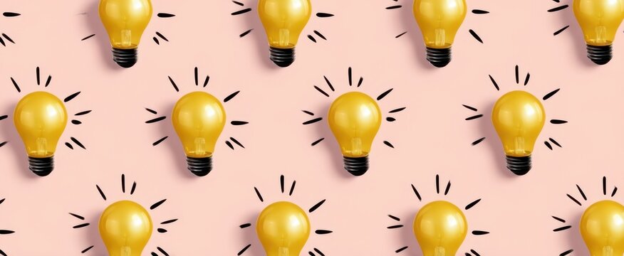 The vibrant yellow lightbulbs illuminating a playful pink background pattern.