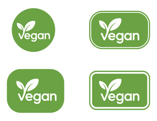 Four Vegan Logos in Green and White