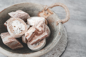 Assortment of halva. Uzbek cuisine. Halva is a sweet confectionery product made from ground sesame seeds or sunflower seeds combined with sugar and nuts. Oriental sweets