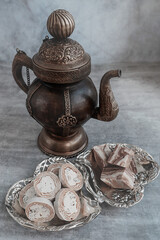 Assortment of halva. Uzbek cuisine. Halva is a sweet confectionery product made from ground sesame seeds or sunflower seeds combined with sugar and nuts. Oriental sweets