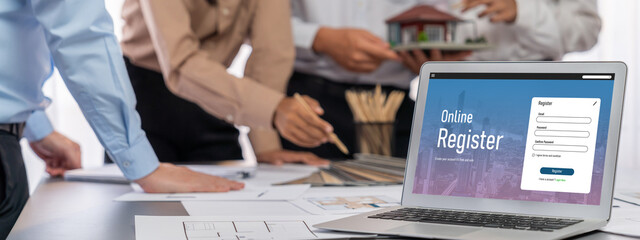 Group of interior architect designer discussing together on blueprint and laptop screen display...