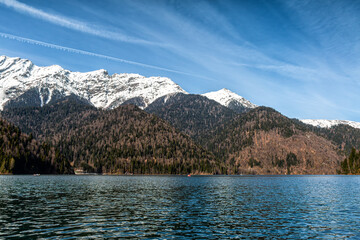 Scenic lake and high snow capped mountains in the background