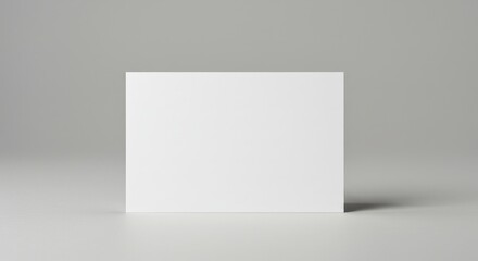 Fototapeta premium Blank White Card Mockup - A clean, simple of a blank white card on a gray background, perfect for showcasing your design