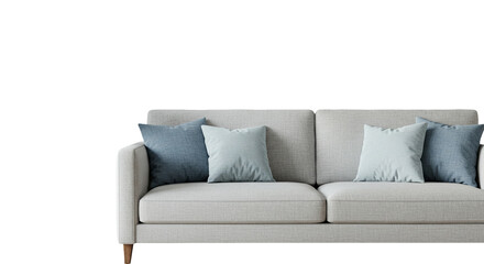 Close up of a white couch with blue and light blue pillows in a dark and bright room setting