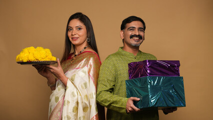 Portraits of young Couple wearing traditional outfits on festival