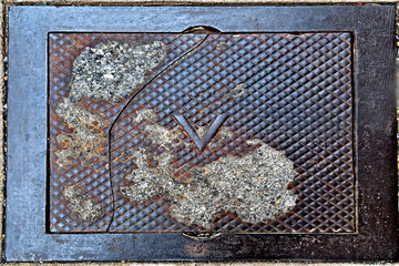 Old  broken electric vault cover from bygone era, Bisbee, Arizona 